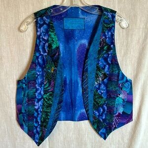 Hand quilted open front vest blues purples and green.